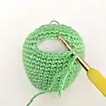 Colourful Mini Dino Amigurumi Pattern step 4 - final assembly and finishing