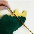 Adorable Dino Pillow Crochet Pattern step 4 - final assembly and finishing